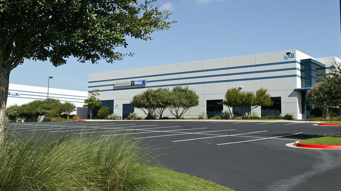 Exterior view of the building with parking spaces 